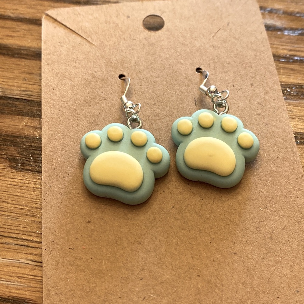 Handmade dog/cat paw earrings. It is green with yellow.
